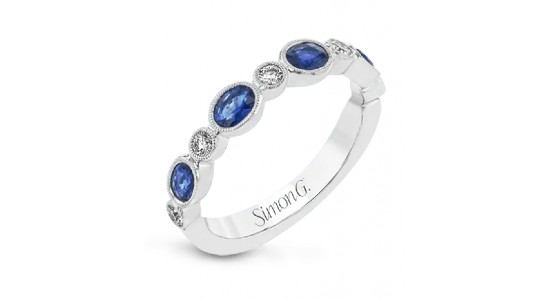 a white gold fashion ring by Simon G. featuring sapphires and diamonds