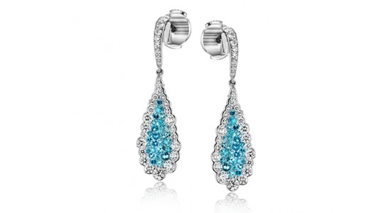 a pair of white gold drop earrings featuring tourmaline and diamonds