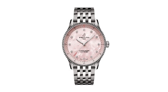 a white gold watch by Breitling with a soft pink dial