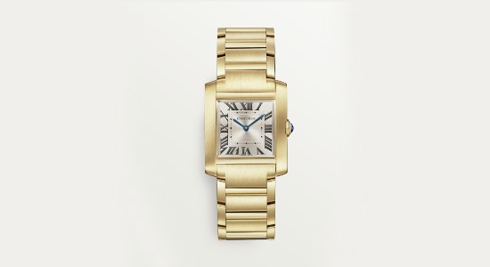 a yellow gold watch by Cartier with a squared dial and roman numeral indices